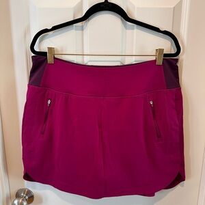 Athleta Fairway Golf Skort Magenta 16” Athletic Skirt Built-In Shorts Zip Pocket